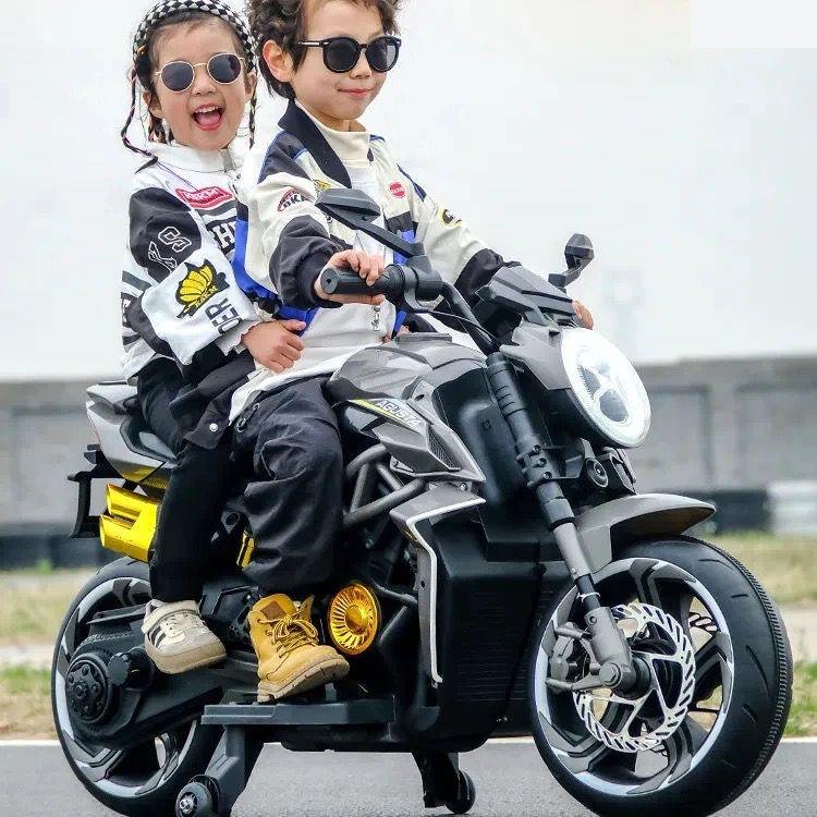 Agusta Kids Motorbike in four colors (Green, Red, Black, Pink) with LED lights, sound effects, and a 12V battery for children aged 3 and up.